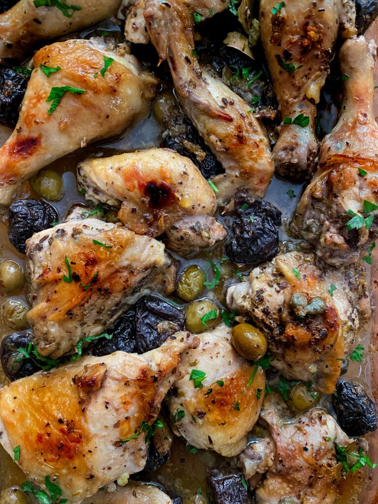 perfectly tender and crisp chicken marbella in a flavourful marinade of olives, capers and prunes