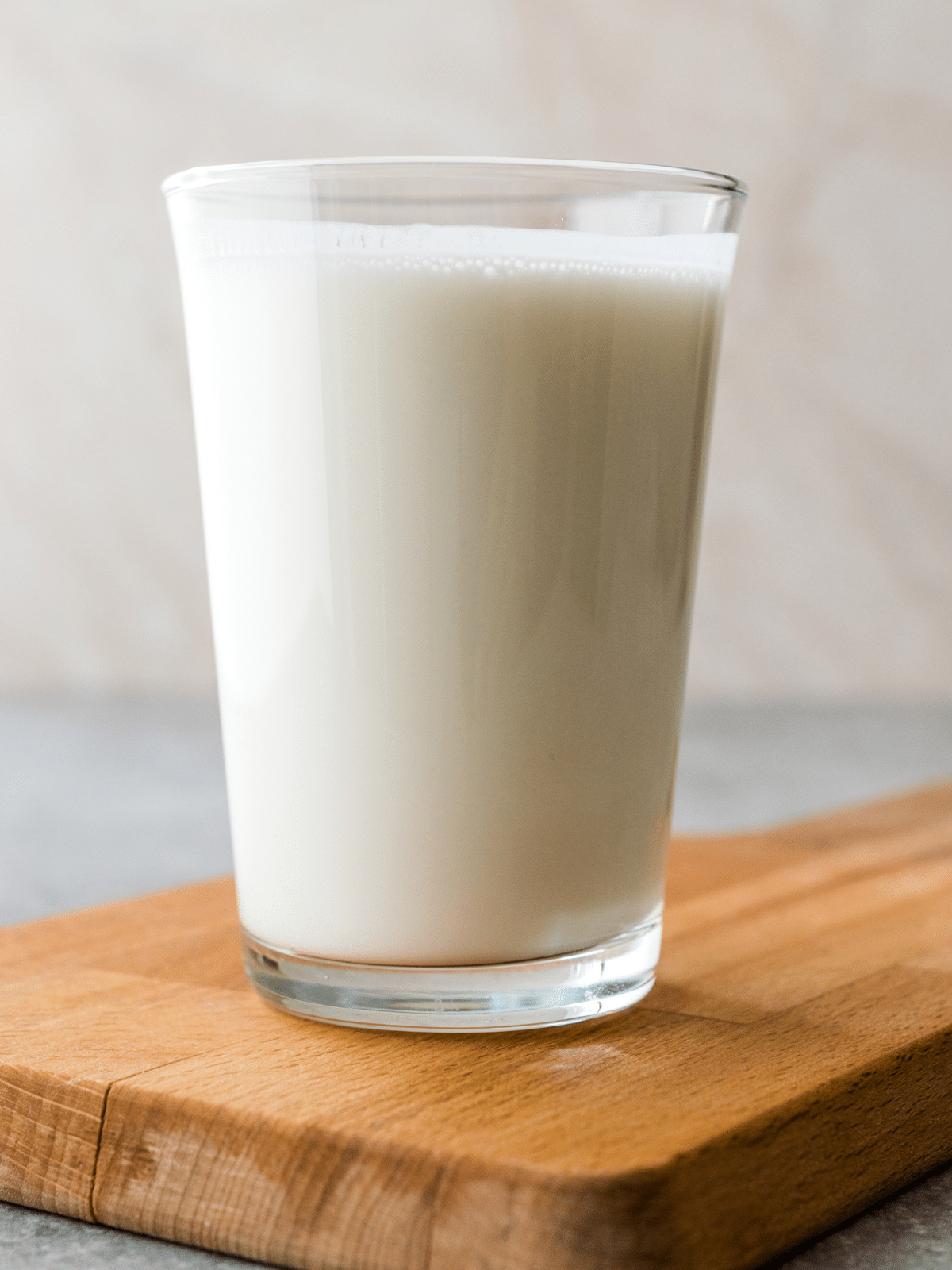 a large glass of buttermilk with ideas on how to use leftover buttermilk