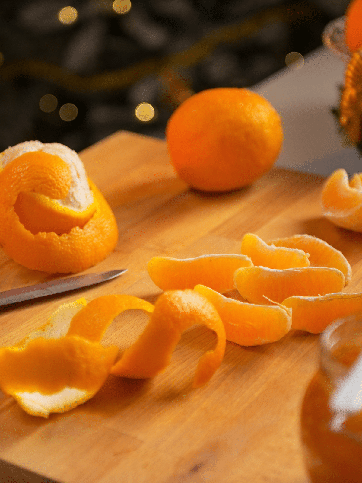 what can i do with leftover orange peels? A small orange peeled on a cutting board