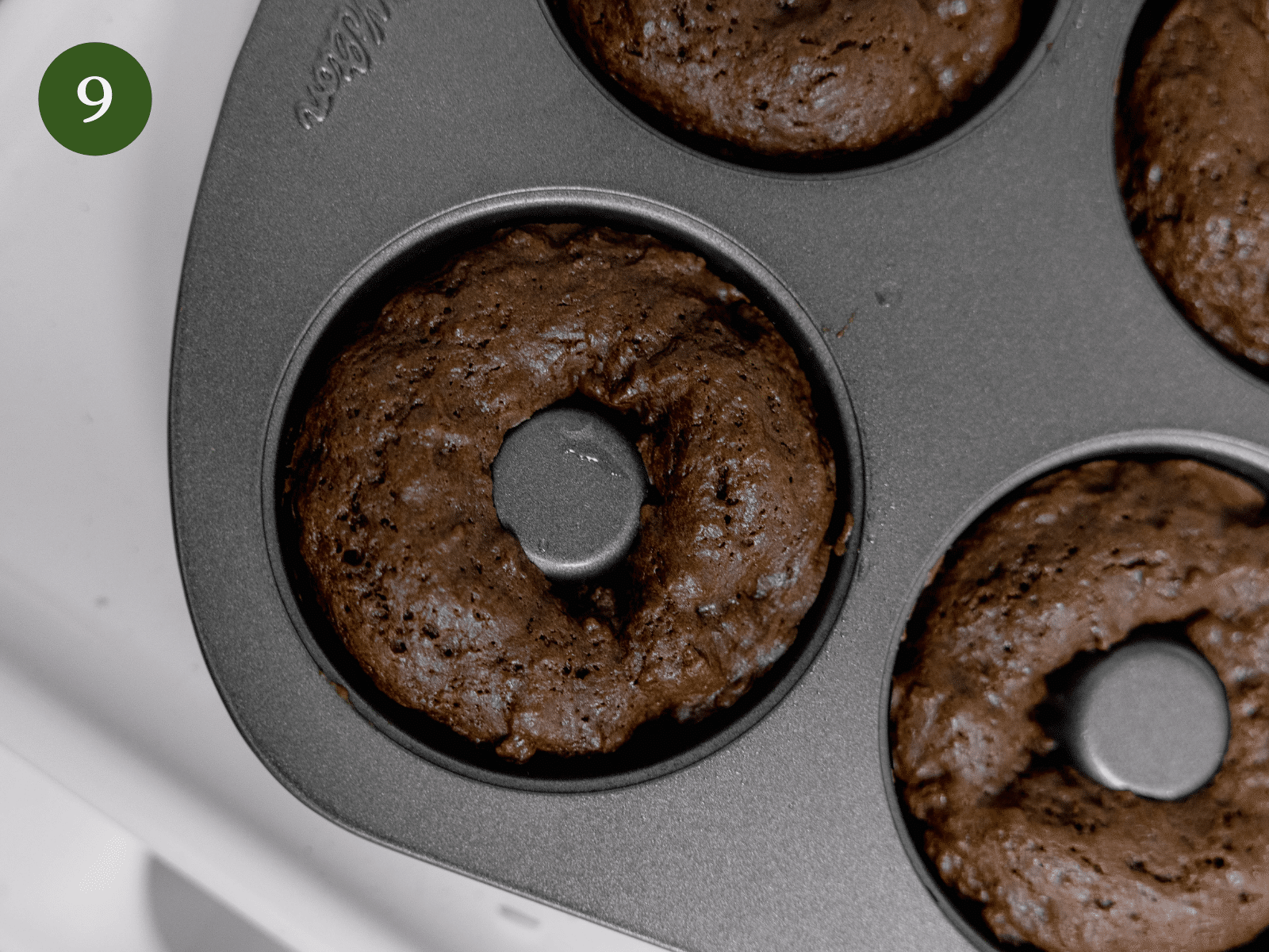 Donuts that have finished baking to show the desired texture.